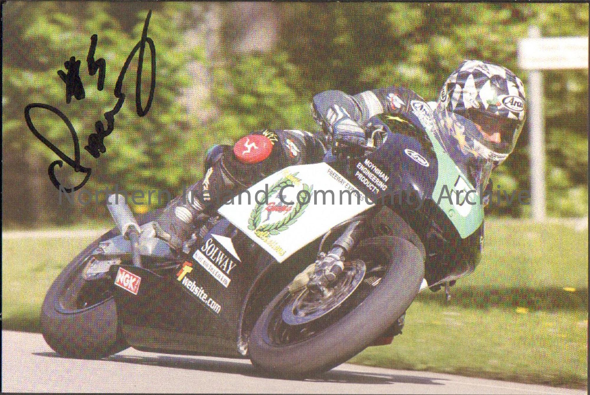 Signed photograph of Chris Palmer riding a black, white and green motorbike with number 5 on the front and black leathers with grass and a hedge in th…