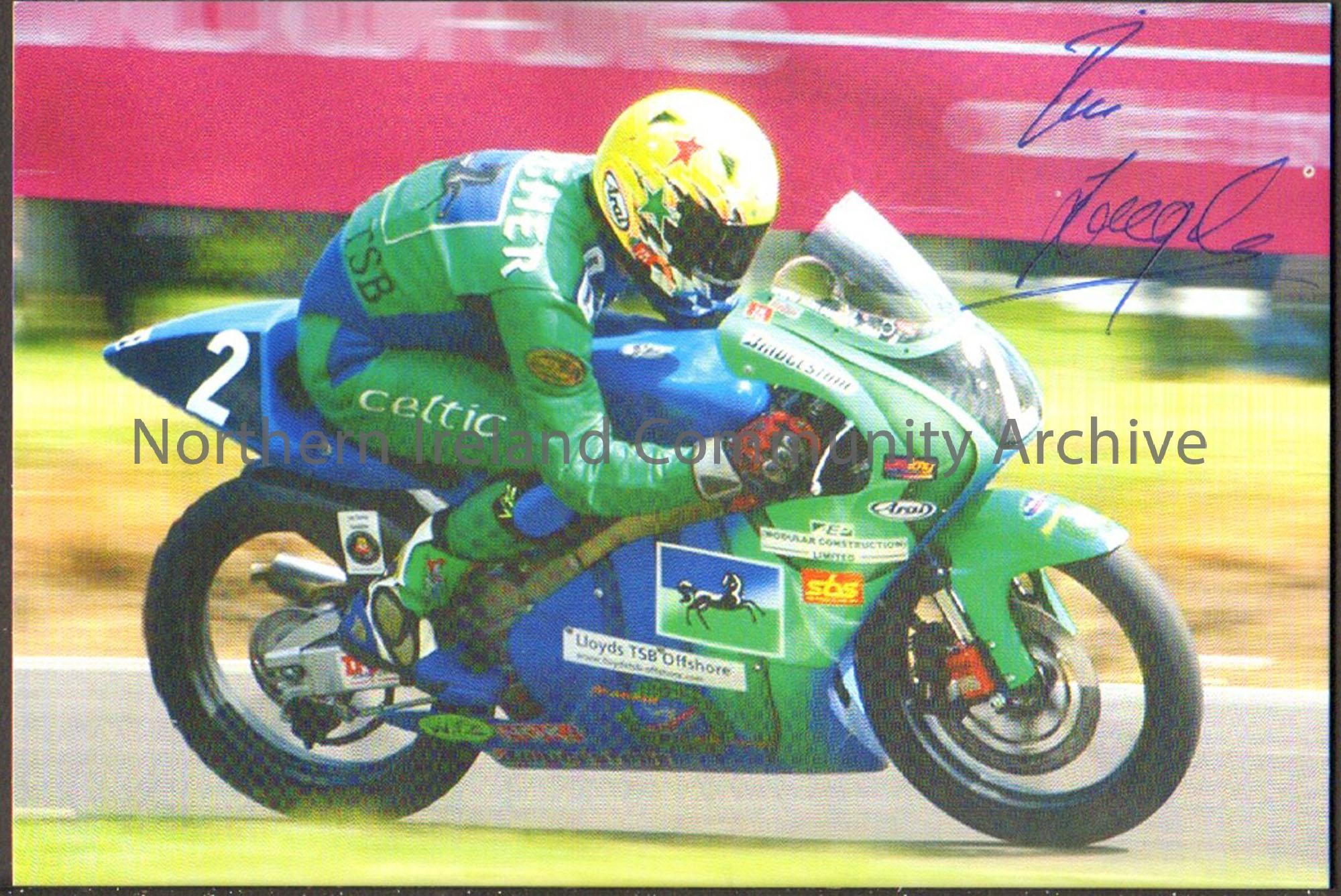 Signed photograph of Ian Lougher riding a green and blue motorbike with number 2 on the side wearing green and blue leathers and a luminous green helm…