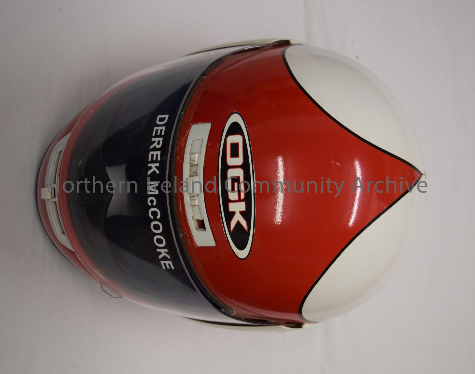 OGK motorcycle helmet belonging to Derek McCooke. Red at the front