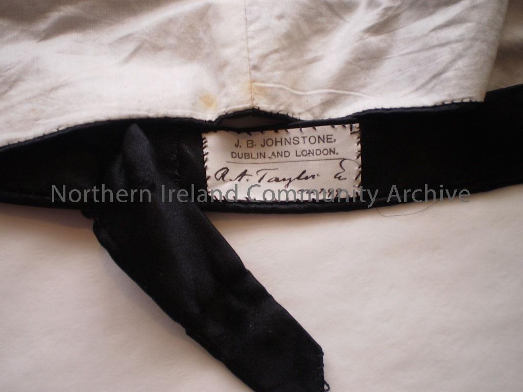 Court suit which belonged to R.A Taylor of Coleraine. The suit consists of a blue velvet dress jacket, a pair of plain black stockings, a pair of blac… – 015
