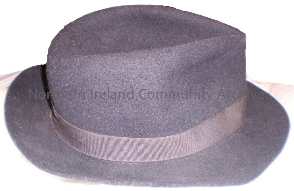 Trilby black hat which belonged to Ronnie Gamble’s father. He was given this when he was demobed from military service. The label on the inside reads … – 2