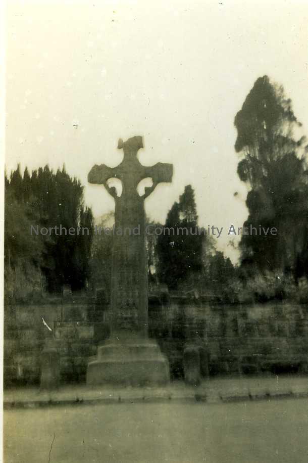 black and white image of old cross monument