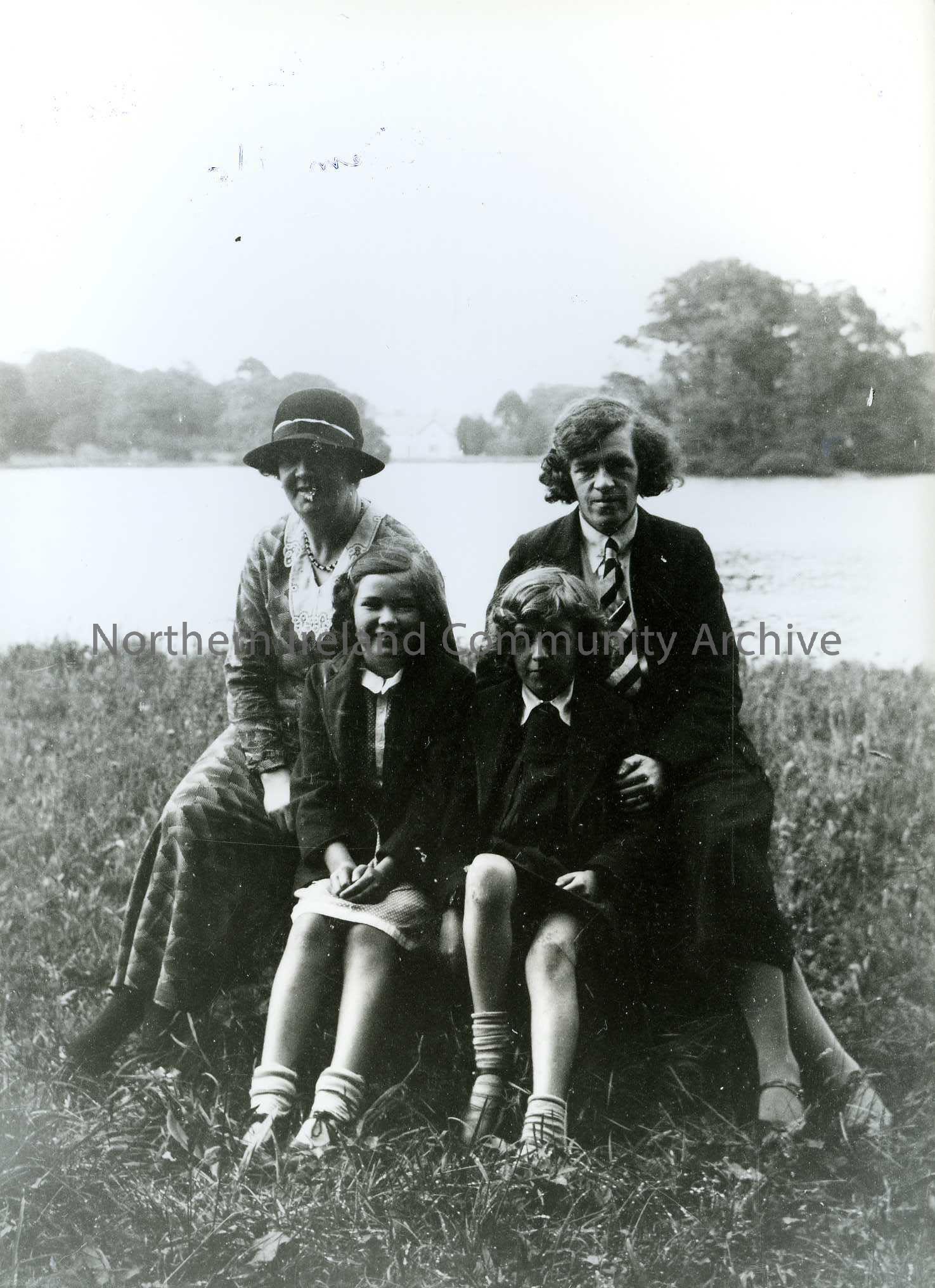 Printed black and white photograph – Olive with her mother Maimie Henry (nee Liken) sit beside another girl and woman.