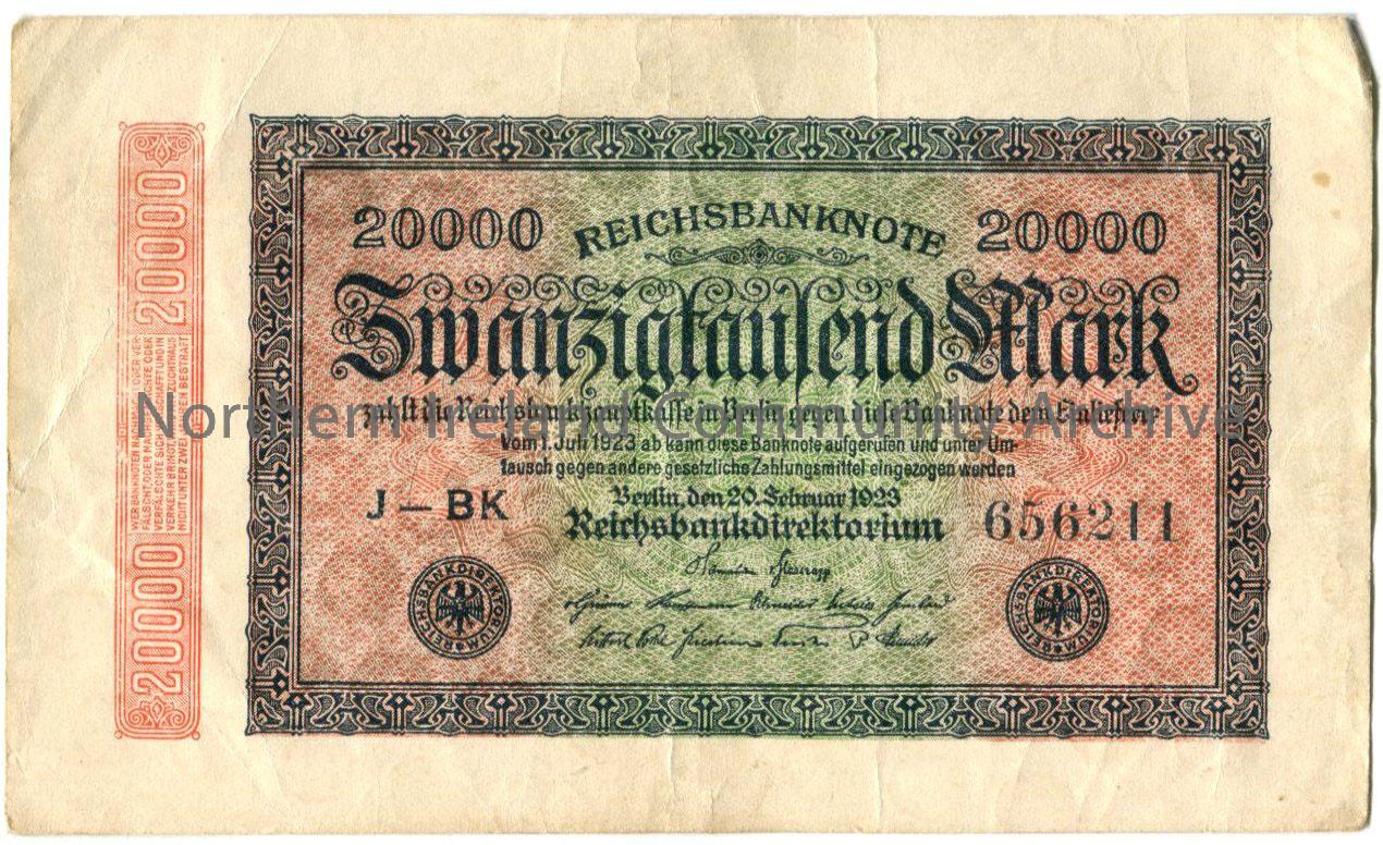 Banknote 20000 German Mark. Red and green stripe on a cream background with an intricate black border. Zwanzigtausend Mark written in Gothic style wri…