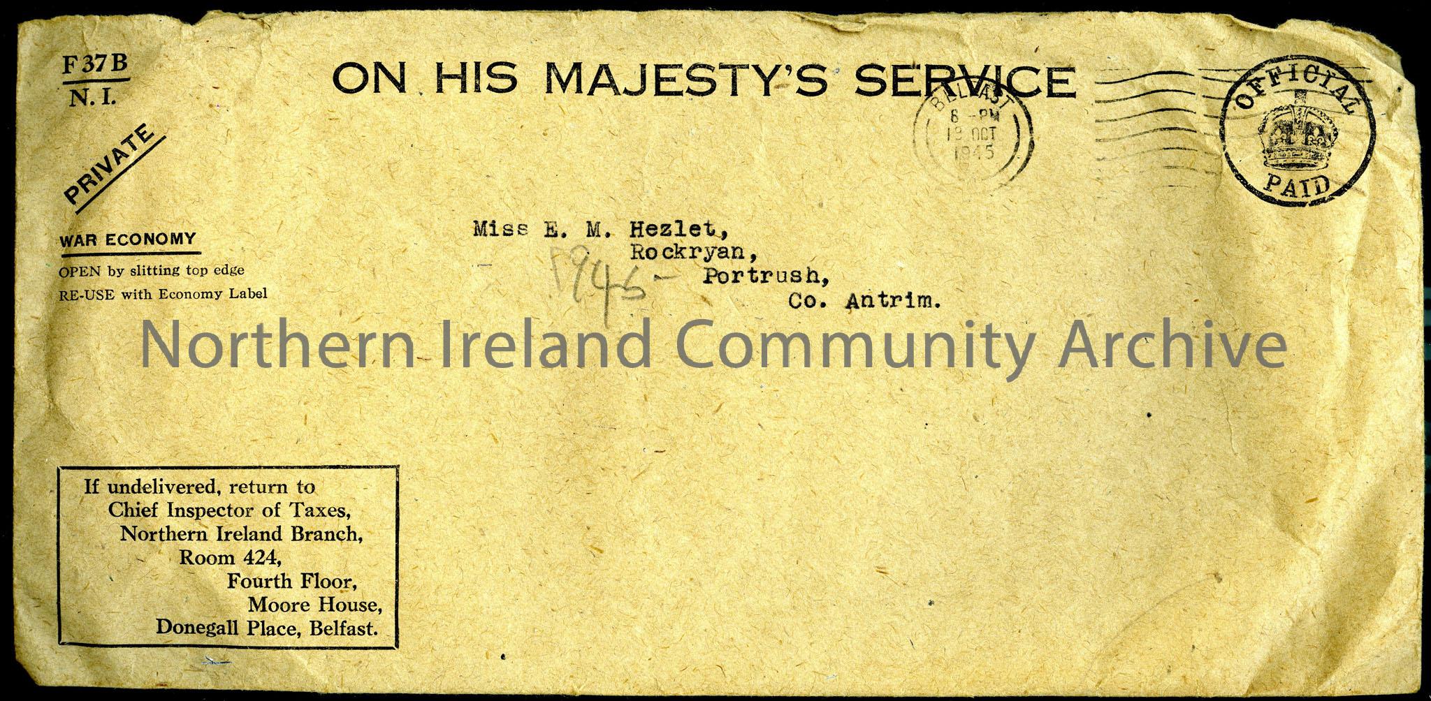 Brown paper envelope with ‘On His Majesty’s Service….Official Paid…War Economy’ etc. stamped on front. Also, address visible: ‘Miss E. M. Hezlet, …
