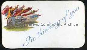 Small card found inside embroidered postcard – field gun, flags of UK and allies, ‘I’m thinking of you’.