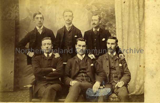 Photograph of a group of six unnamed gentlemen.  The photo was taken by W. Mack whose studio was in New Row at the time.