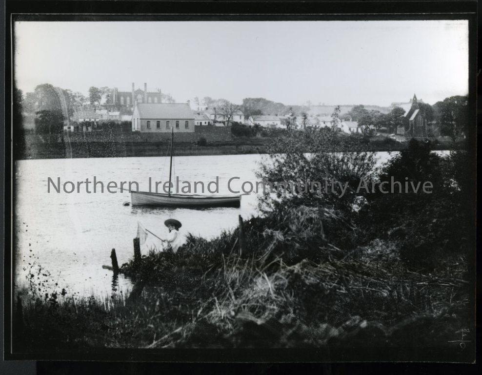 Black and white photograph of young girl fishing with net in River Bann, view of Killowen side of Coleraine (2657)