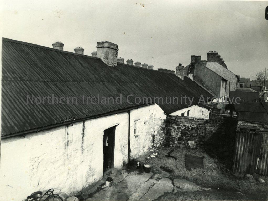 Black and white photograph of 76/77 Long Commons (looking down the street at the rear), Coleraine, 1957 (2138)