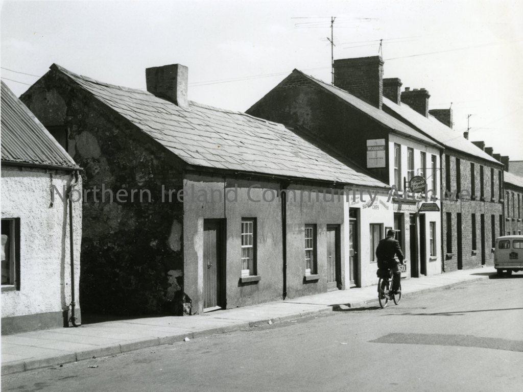 Black and white photograph of No28, 30, 36 & 38 Killowen Street, No32 Chip Saloon, No34 Grocers Shop, Coleraine, 1957 (4587)