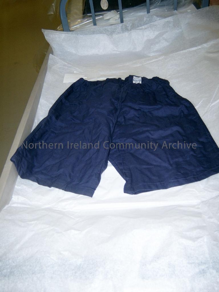 navy canvas shorts. Label reads size no.3, waist 34 inches. Conlowe Ltd. 1941. (3133)