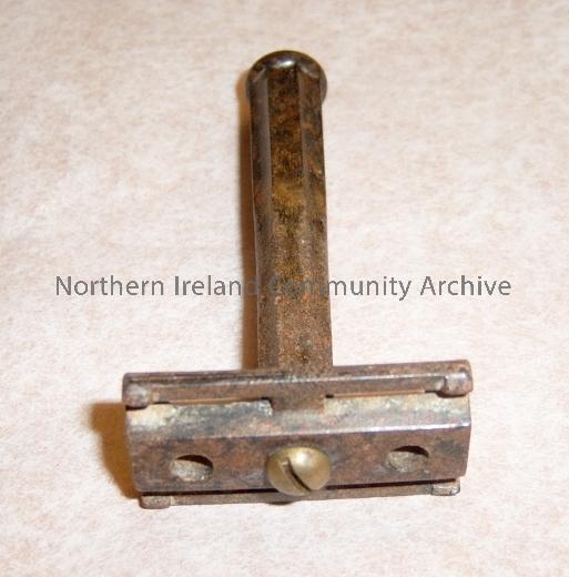 black safety razor with no blade. Used by the donors father it is made of bakelite material, forerunner of plastic.  (4955)