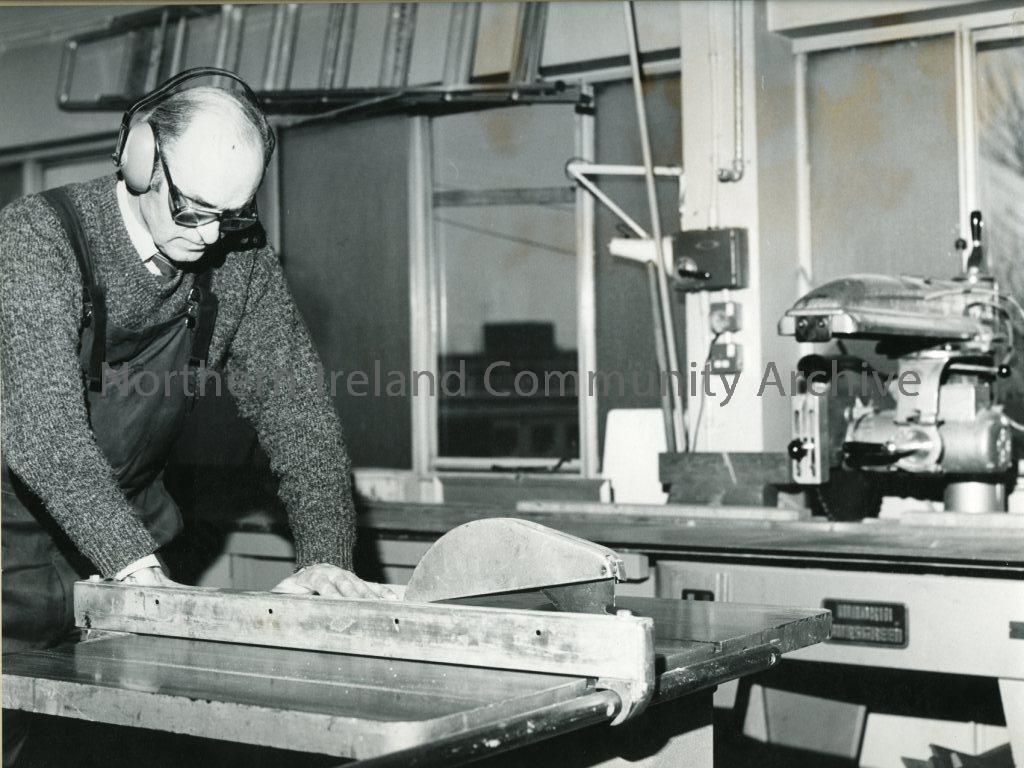 black and white photograph of a man in a workshop  (2670)