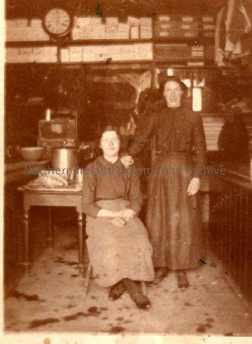 Two women in Leeper’s shop on the left hand side of Main Street, Dervock heading towards Carncullagh. The shop later was owned by Thompsons and Lougheads. Lastly owned by Hugh McCaughan and then knocked down. (2046)