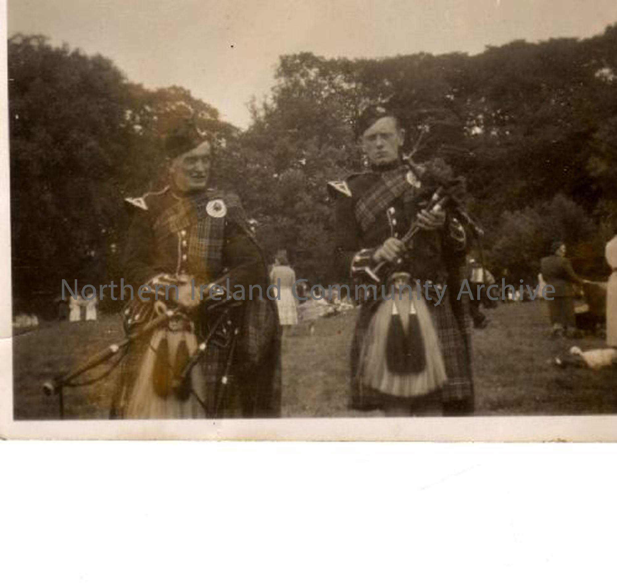 Two men with bagpipes, twelth of July. They are part of Greenhills Pipe Band from Ballymoney. Sammy Wade went on to raise a family of pipers while Ernie McLernon emigrated as a ten pounds pom to Australia and has since settled in New Zealand. (3084)