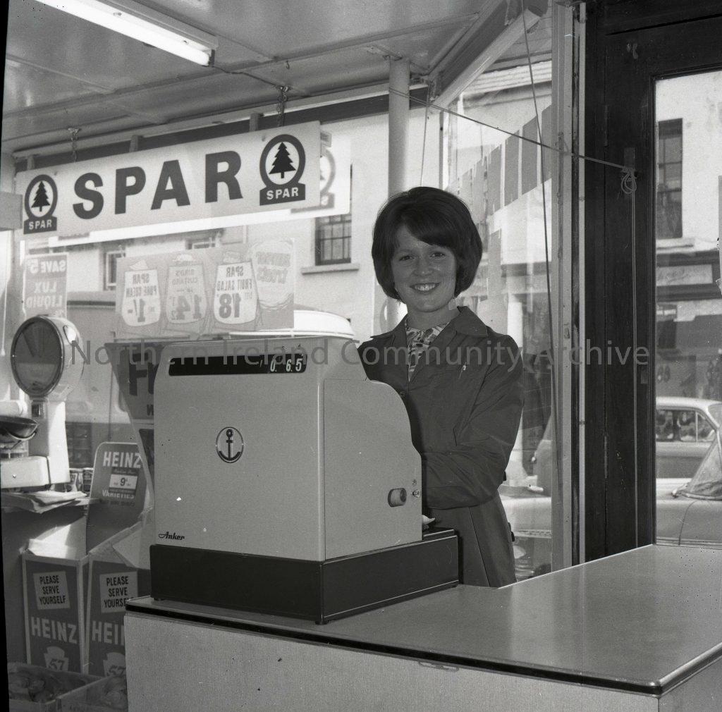 Self Service Grocery in Bushmills, Aug 1963, woman at till