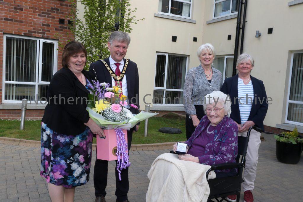 Centenarian receives commemorative coin from Mayor of Causeway Coast and Glens Borough Council – Edith Gilmore