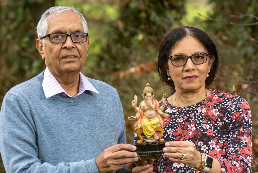 Indu and Naresh holding Ganesh