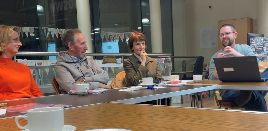 Fout GVLC participants seated at a table.