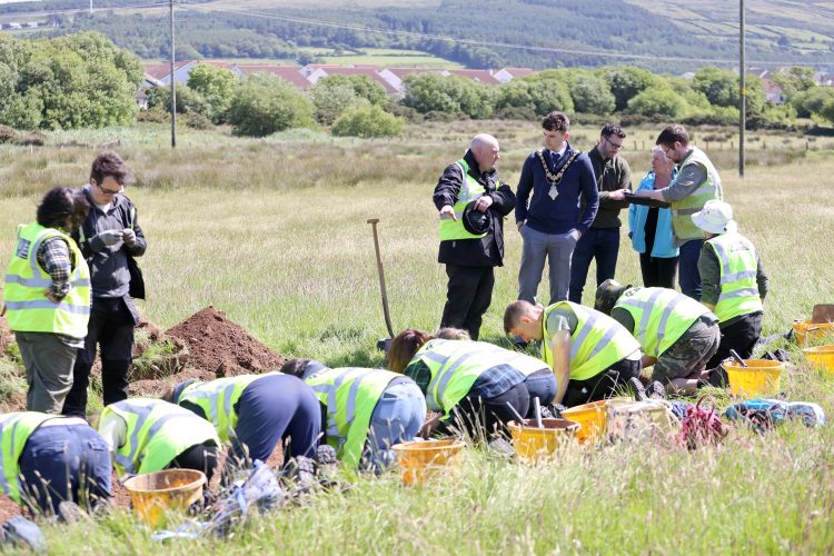 PR photograph showing the mayor of CCGBC at the excavation